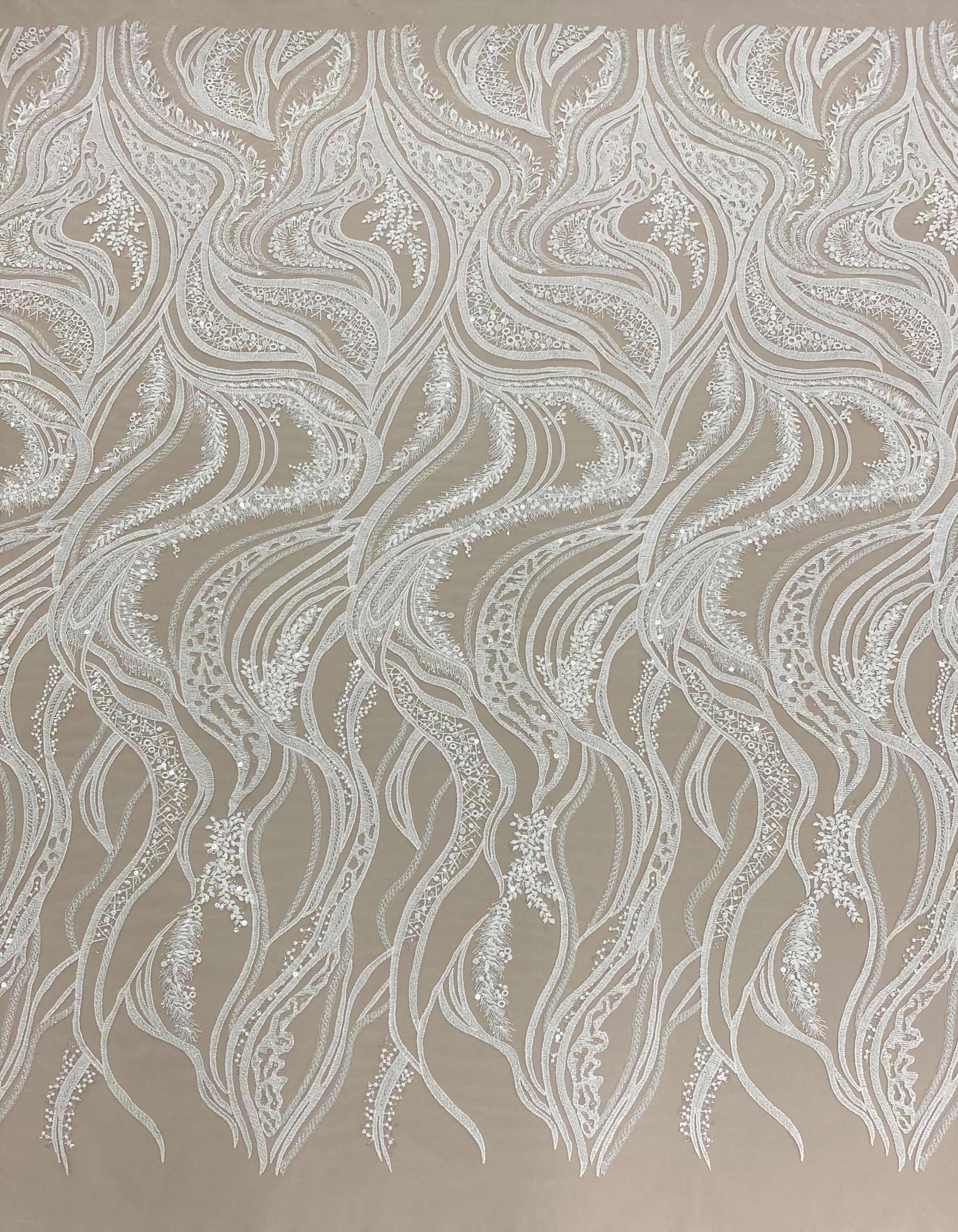 Ivory Embroidered Tulle — featuring scalloped edges, hand-beading and sequins, 50% nylon 50% rayon, 130cm wide