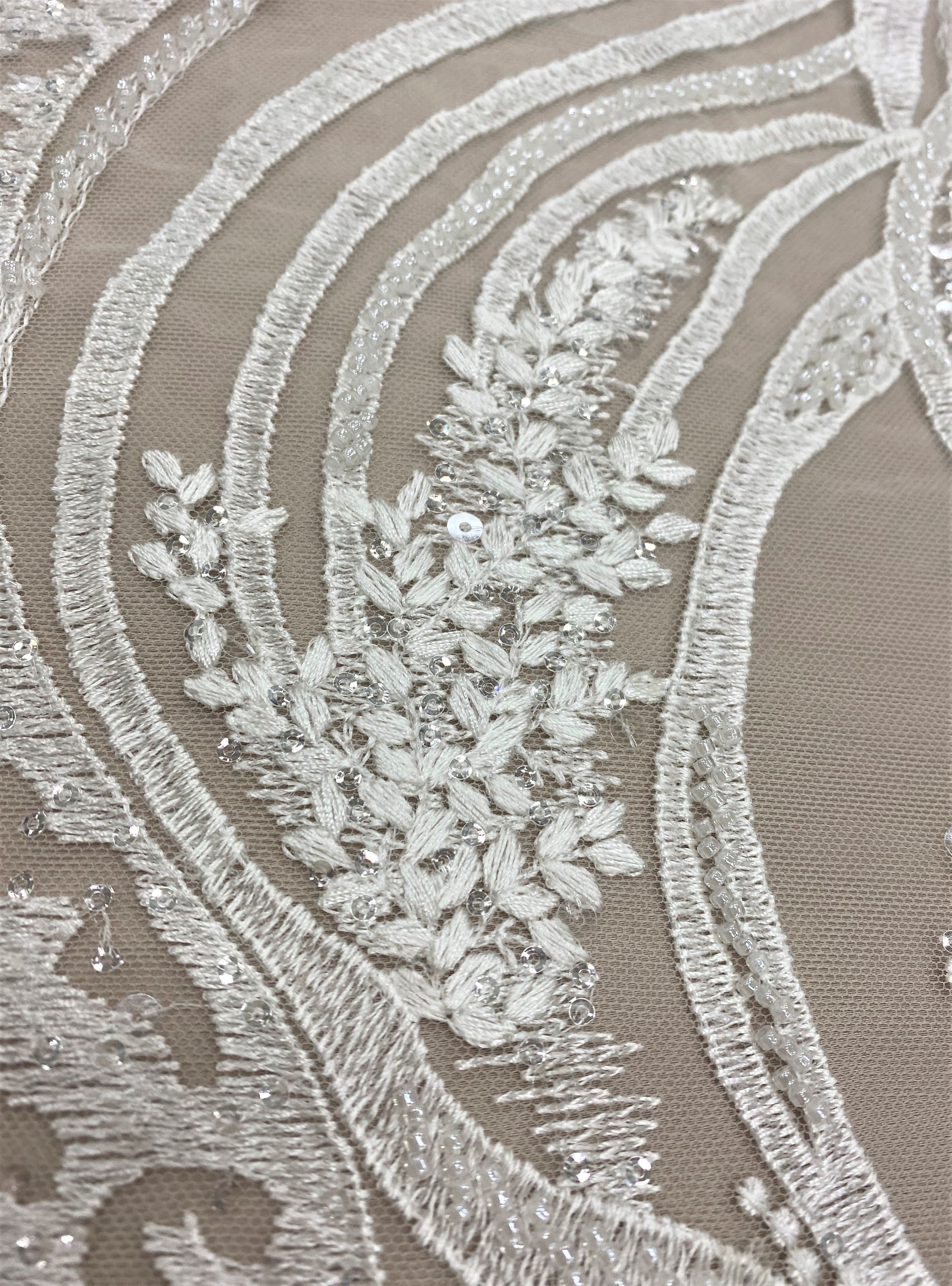 Ivory Embroidered Tulle — featuring scalloped edges, hand-beading and sequins, 50% nylon 50% rayon, 130cm wide