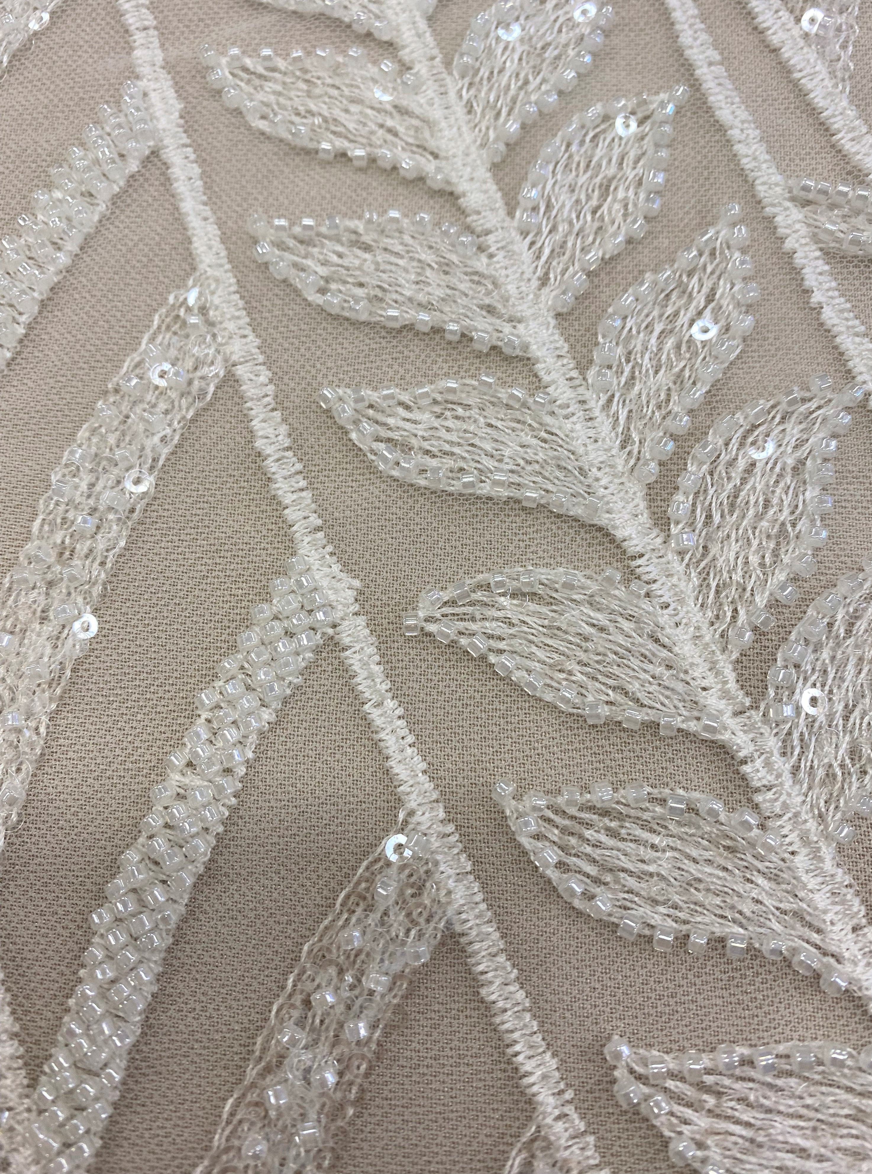 Ivory Embroidered Tulle — soft, 50% nylon 50% rayon, 130cm wide