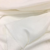 Silk White Linen — mid-weight plain-weave linen with a slightly crisp handle that softens with wear, 100% linen, 135cm wide