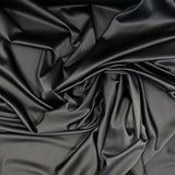 Black Stretch Polyester Lining — lightweight with a satin finish, matte reverse and gentle stretch, in polyester