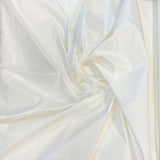 Ivory Taffeta — a mid-weight silk taffeta with a smooth texture and crisp handle, 100% silk