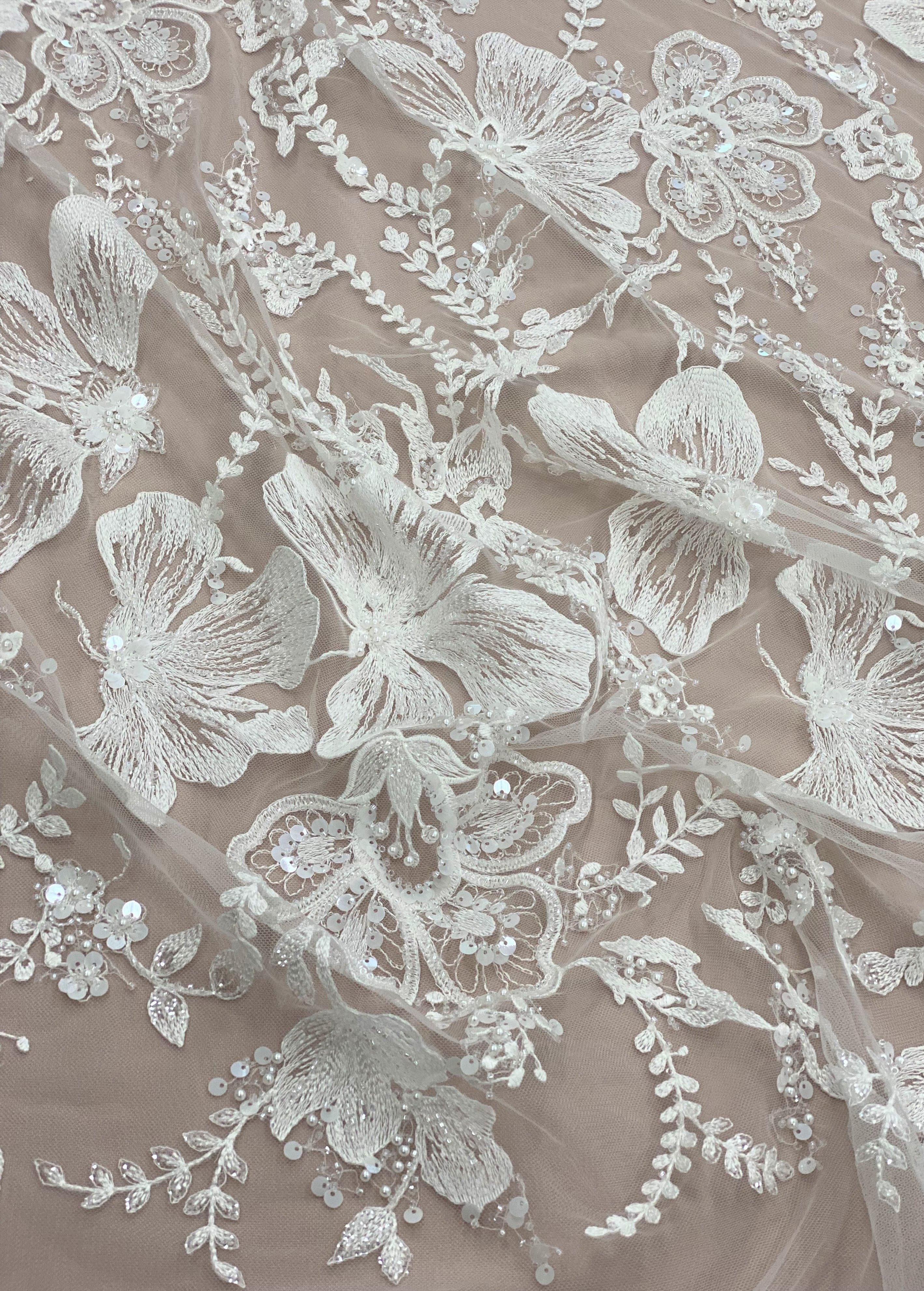 Ivory Embellished Tulle — featuring floral motifs and hand-beading, 60% rayon 40% nylon, 140cm wide