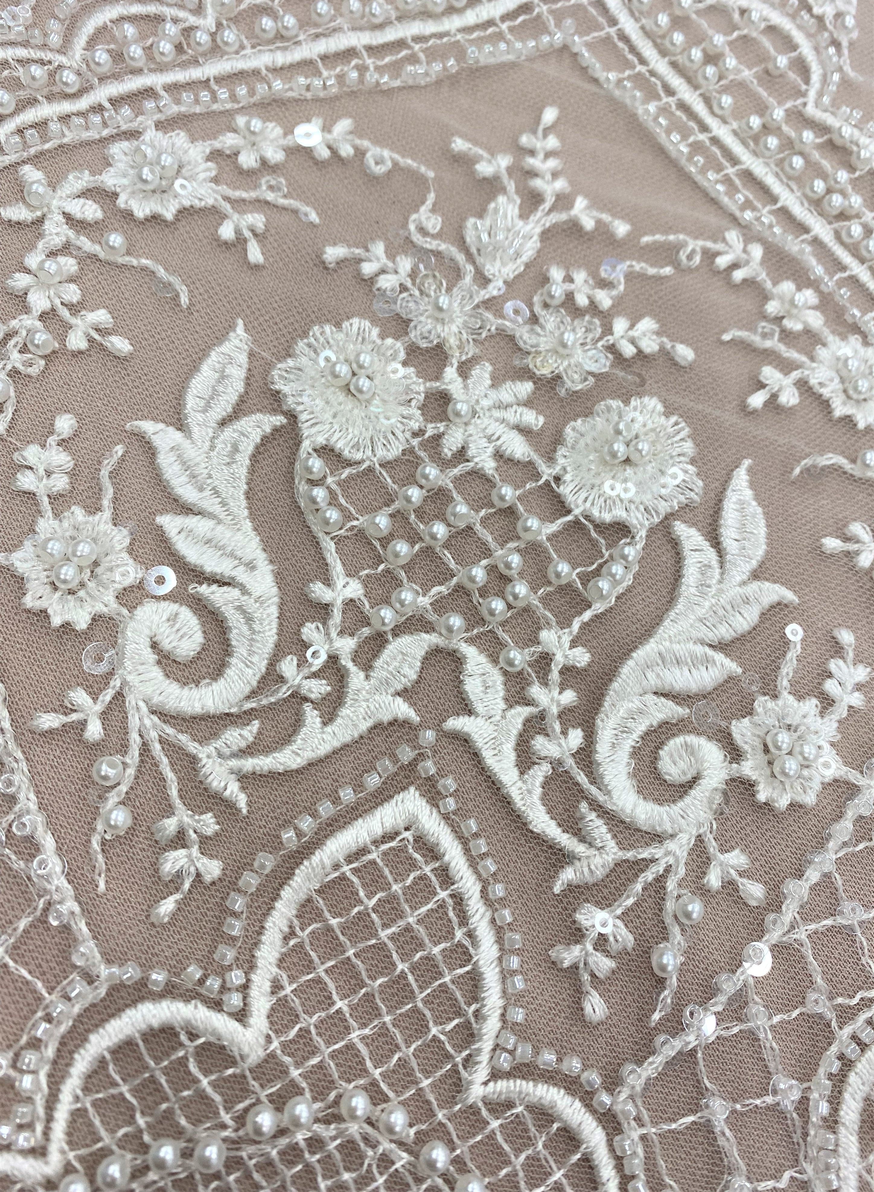 Ivory Embellished Tulle — featuring floral motifs, hand-beading and sequins, 60% rayon 40% nylon, 140cm wide