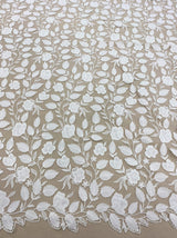 Ivory Embroidered Applique Tulle — featuring scalloped edges, floral motifs and a leaf design, 40% nylon 40% polyester 20% cotton, 130cm wide