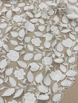 Ivory Embroidered Applique Tulle — featuring scalloped edges, floral motifs and a leaf design, 40% nylon 40% polyester 20% cotton, 130cm wide