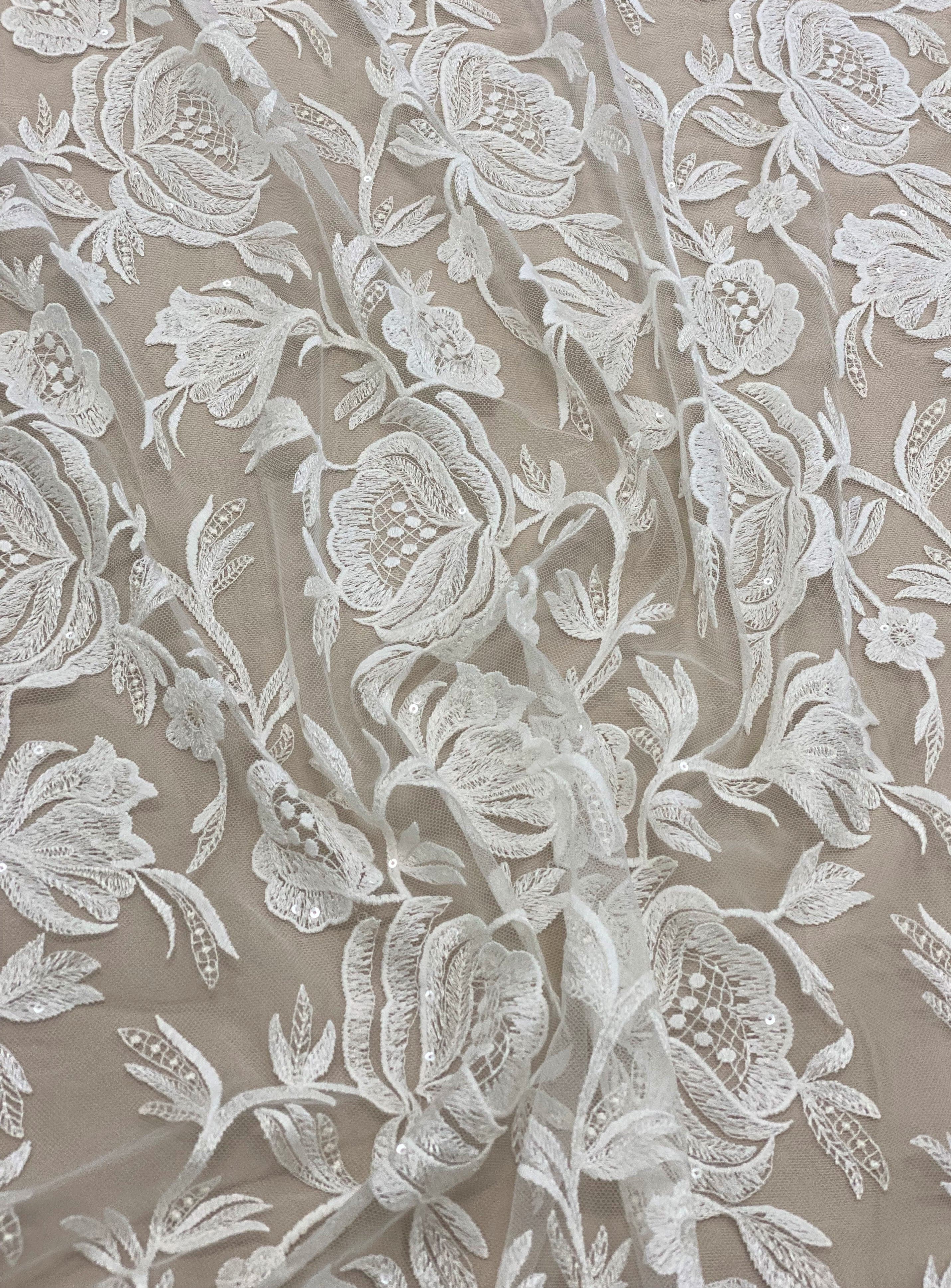 Ivory Embroidered Tulle — featuring scalloped edges, floral motifs and sequins, 50% nylon 50% polyester, 130cm wide