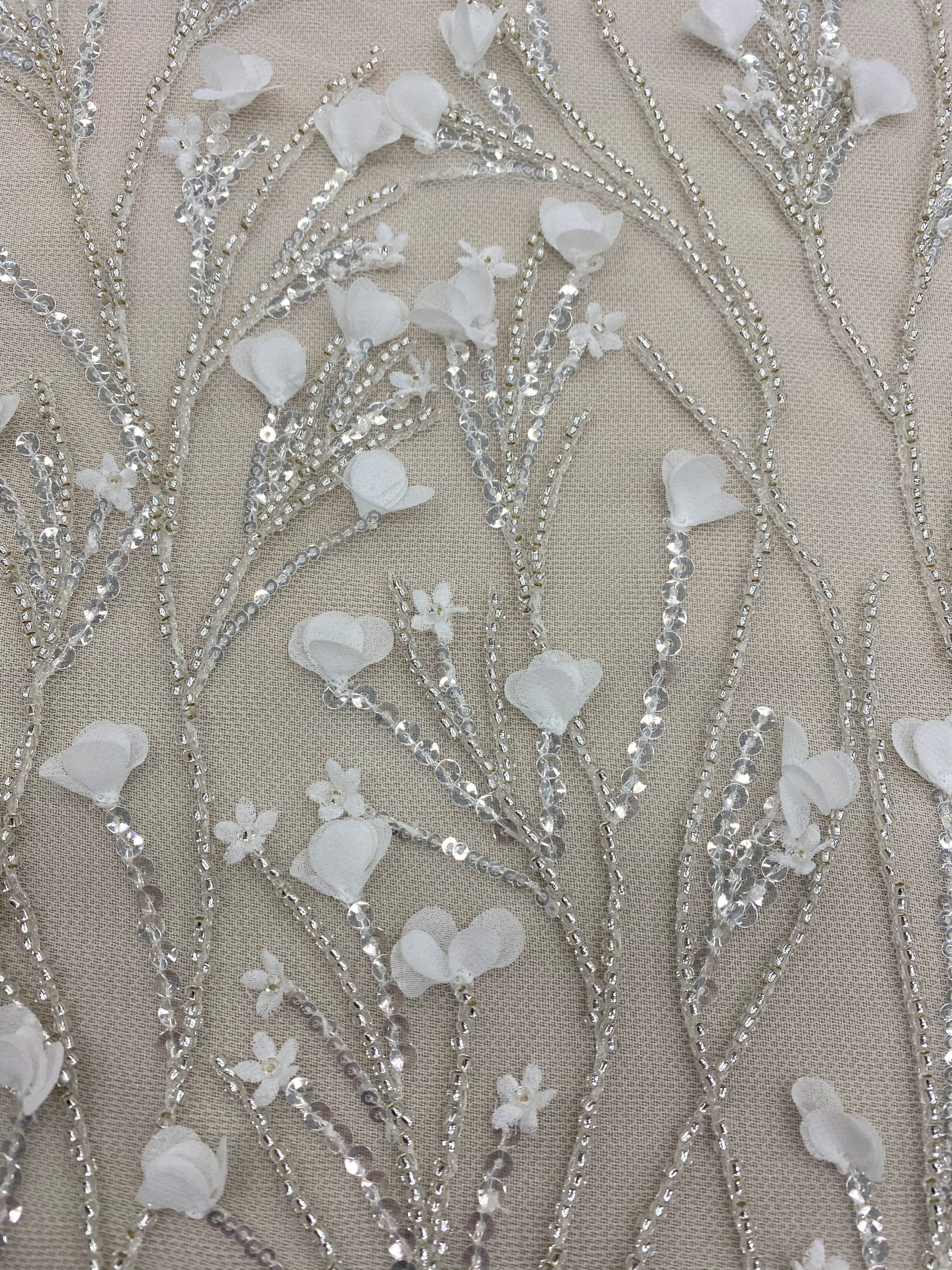 Ivory Floral Embellished Tulle — featuring floral motifs, hand-beading and sequins, 60% nylon 40% metallic, 130cm wide
